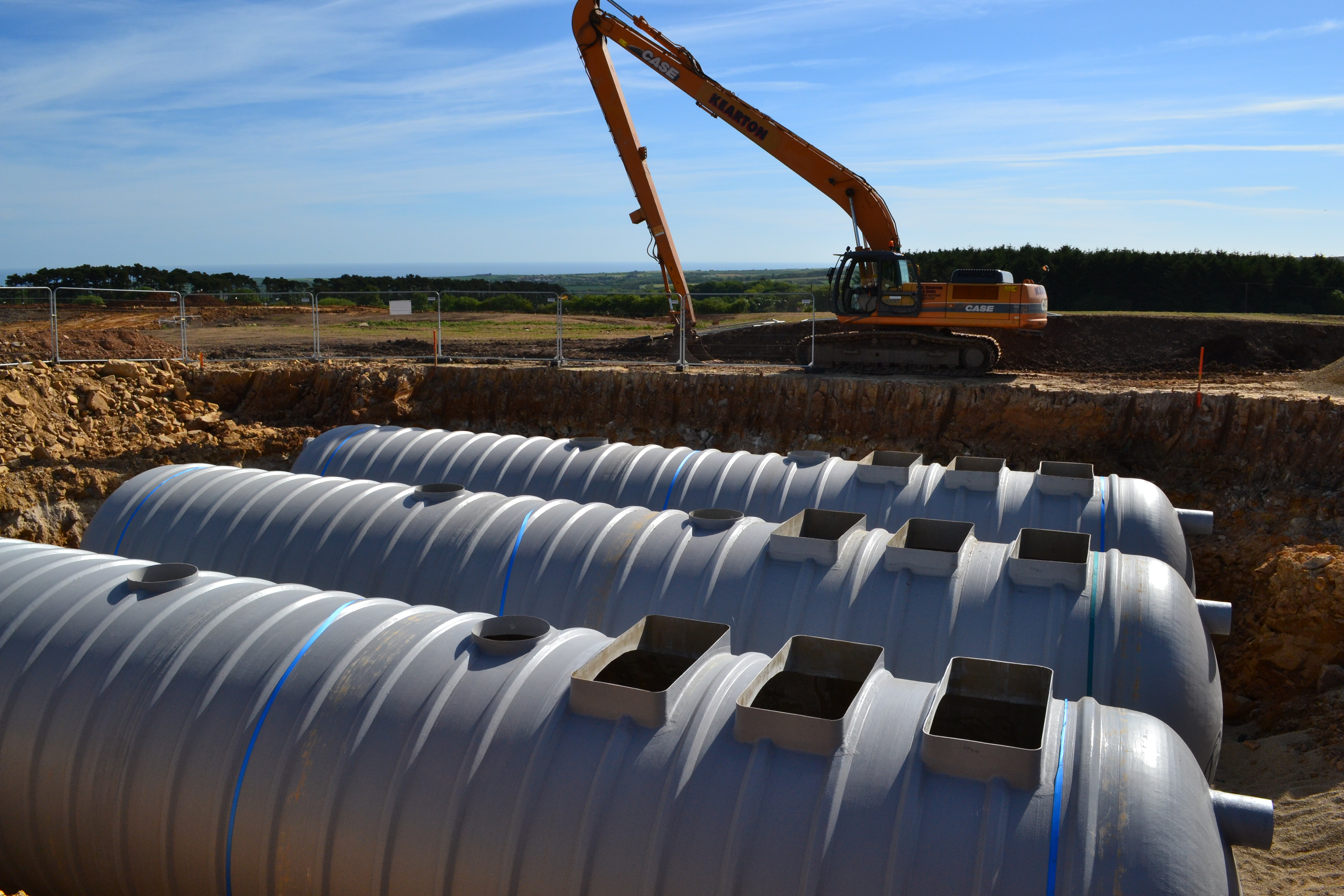 An excavation to install three Rewatec stormwater attenuation tanks.