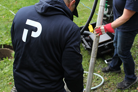 WYSIWYG_sludge removal_450x300 Premier Tech technician removing excessive sludge from an ATU septic system.