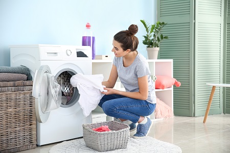 Women using harvested rainwater for washing clothes