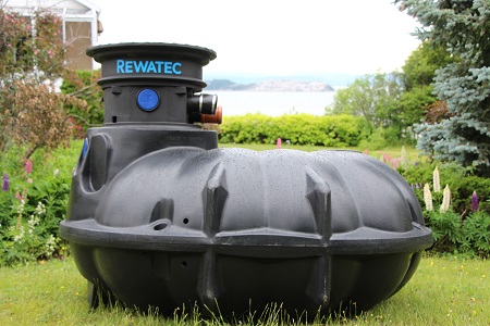 Rewatec NEO rainwater harvester situated in a garden