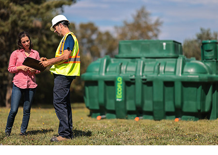 Septic system installer asking his customer questions before he begins work on her property.