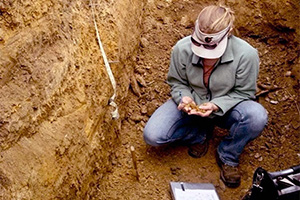 Septic expert performing a soil test.