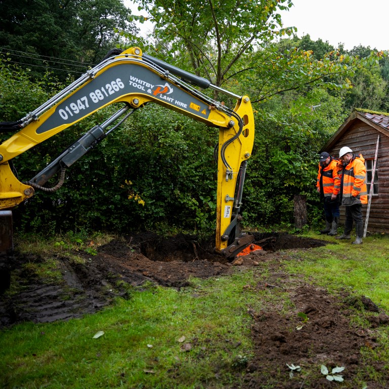 Excavation for a septic system installation in the UK.