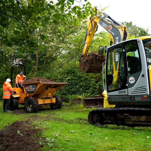 Backfill and compaction for a septic system installation in the UK.
