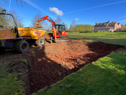 Premier Tech repairing a drainage field.