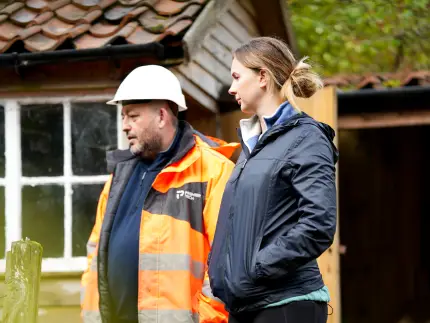 Premier Tech septic technician with homeowner in the UK.