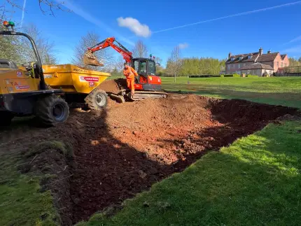 Premier Tech repairing a drainage field.