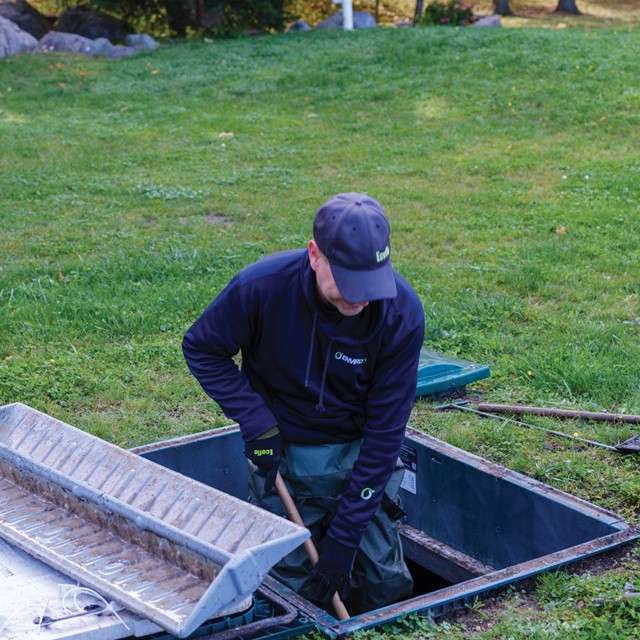 man doing ecoflo green septic system maintenance and inspection 