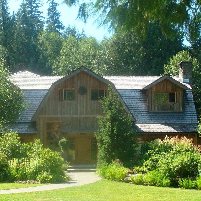 The building and grounds of Brew Creek Lodge in the mountains of British Columbia.