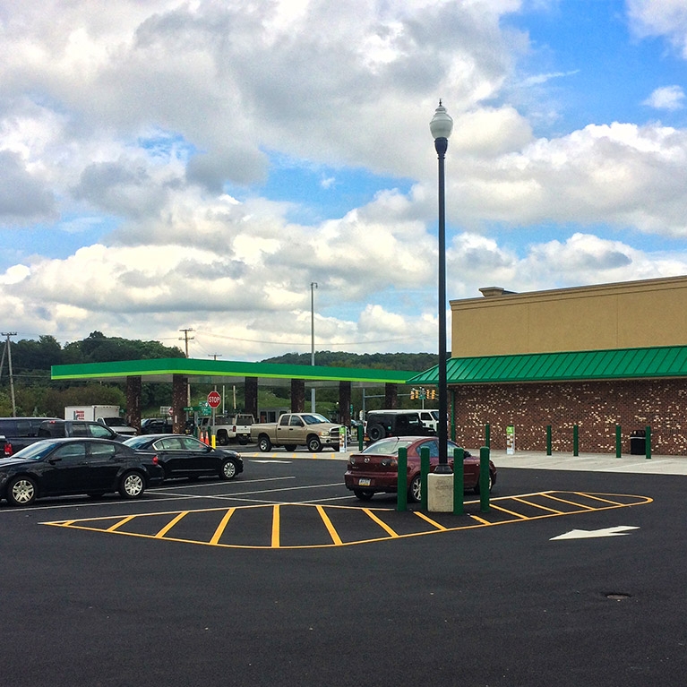 Vehicles parked in front of a QuickChek convenience store in New Jersey.