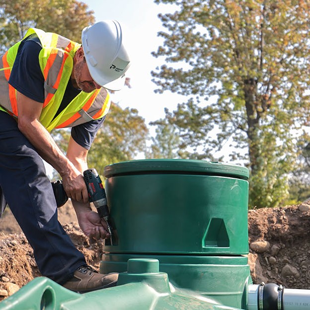 Premier Tech Water and Environment partner installing the Pack model of the Ecoflo biofilter septic system. 