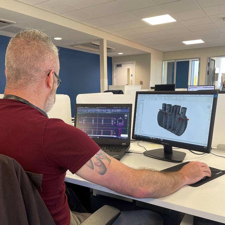 Design engineer drawing a bespoke sewage treatment plant 