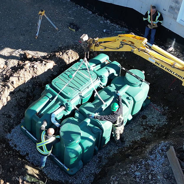 Installation of the Pack model of the polyethylene Ecoflo compact biofilter at a residential site in Ontario.