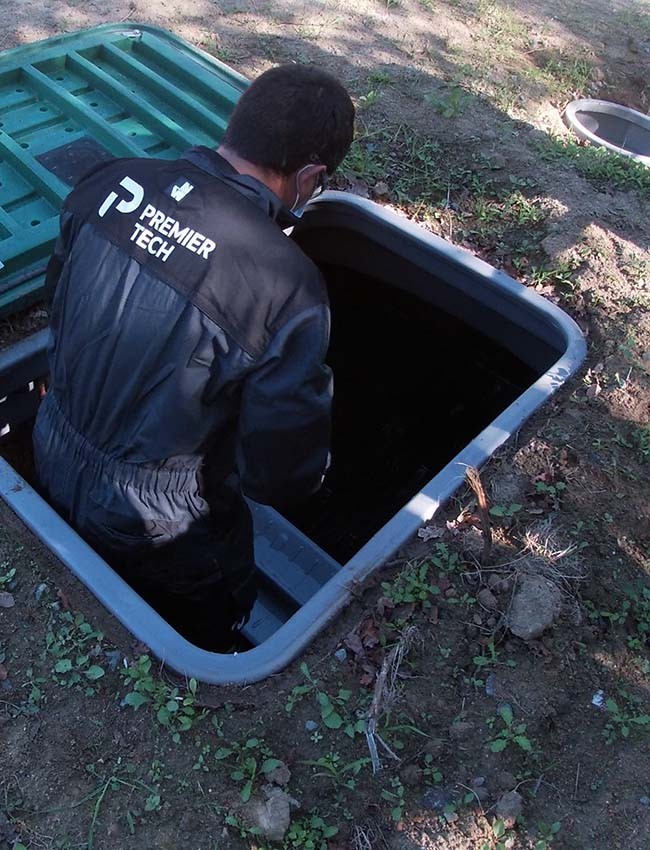 Premier Tech Water and Environment service partner maintaining the Ecoflo biofilter septic system in France.