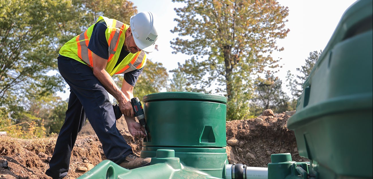 Premier Tech Water and Environment partner installing the Pack model of the Ecoflo biofilter septic system. 