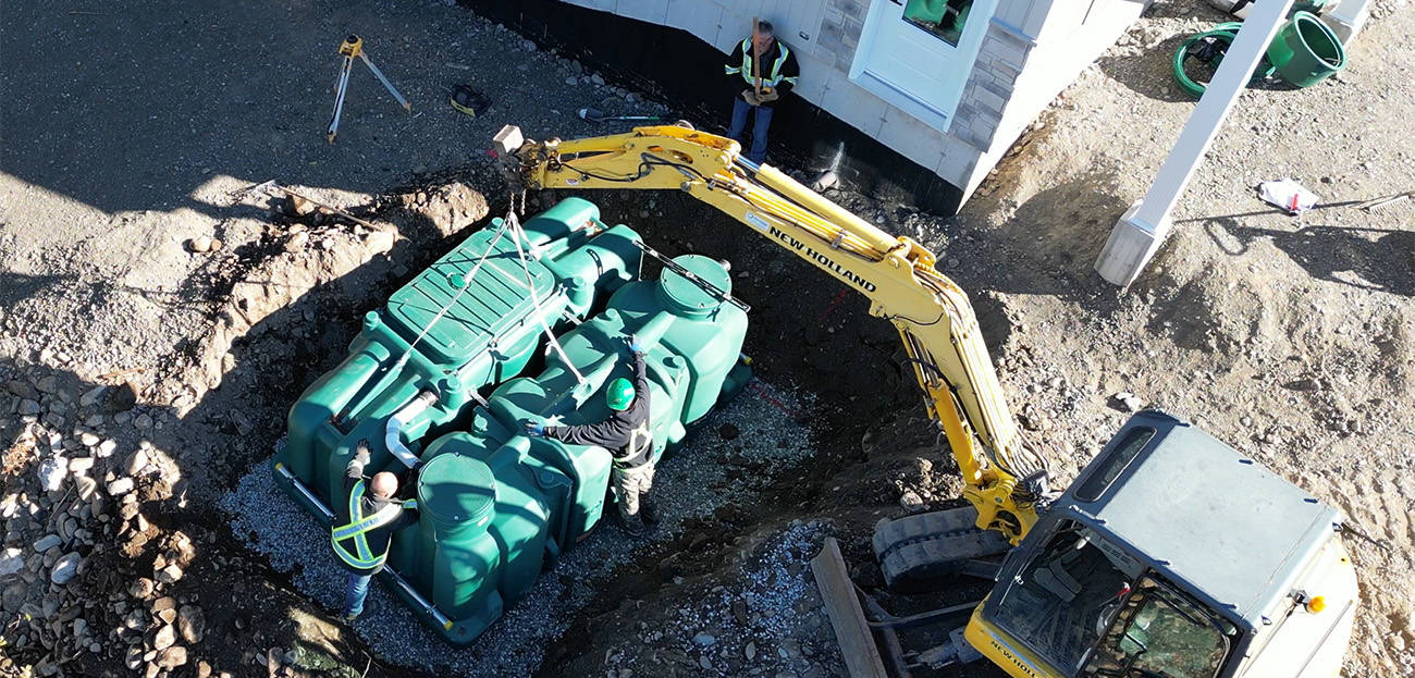 Installation of the Pack model of the polyethylene Ecoflo compact biofilter at a residential site in Ontario.