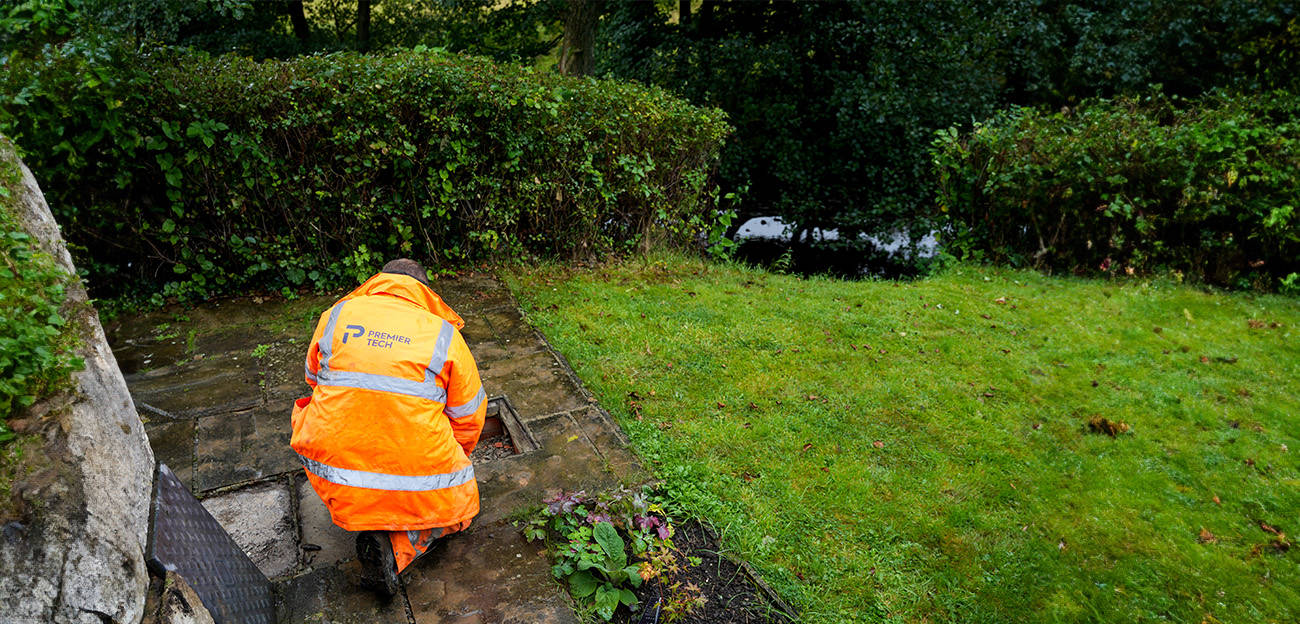 Premier Tech Water and Environment technician inspecting a septic tank in Ireland.