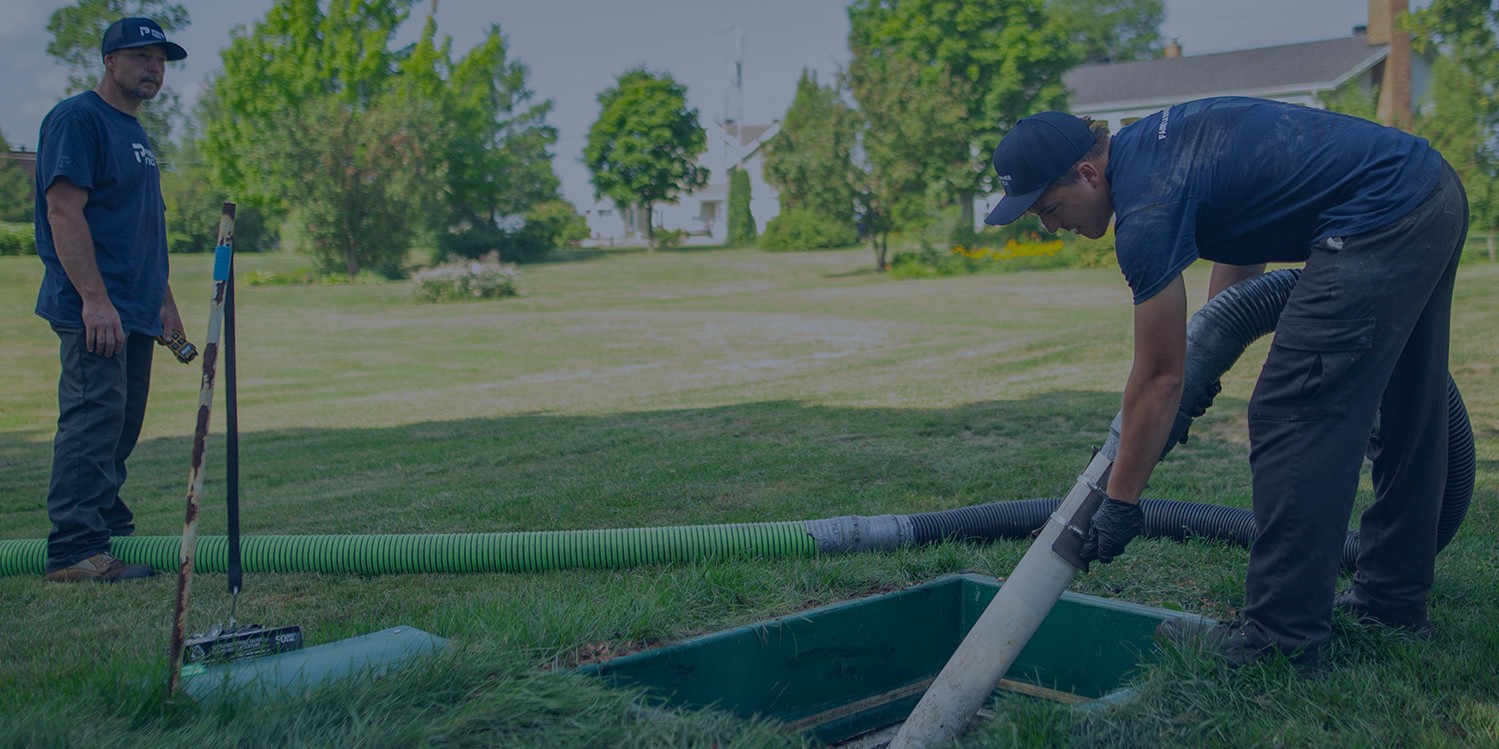 Premier Tech Water and Environment partners performing service on the Ecoflo biofilter septic system on a residential property.