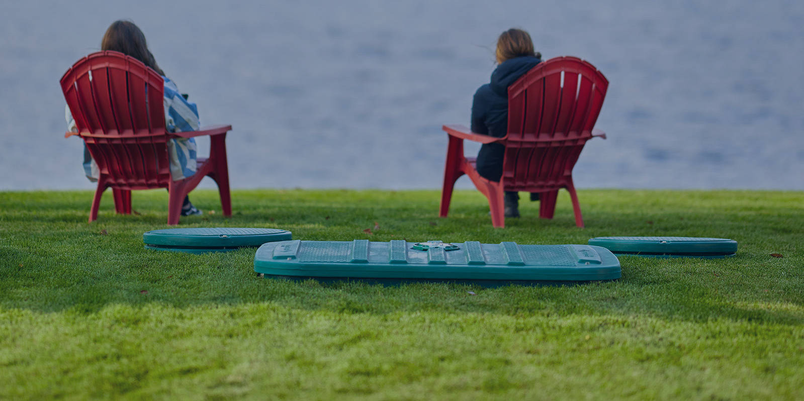 Pennsylvania cottage owners sitting between a lake and the Ecoflo biofilter septic system installed on their property.