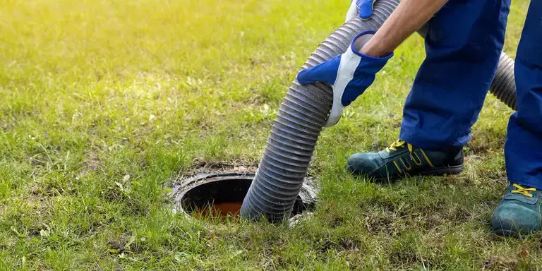 Premier Tech technician emptying a septic tank in the UK.