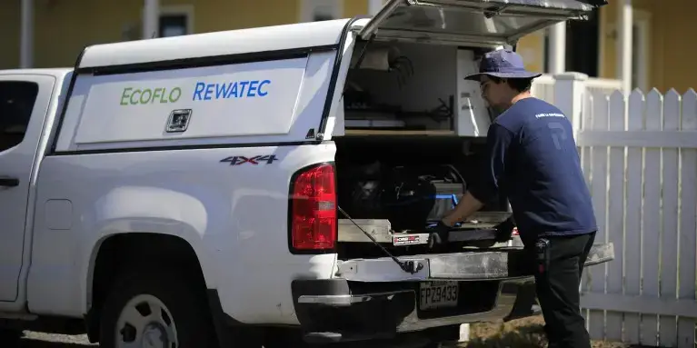 Ecoflo septic system service visit at a residential property.