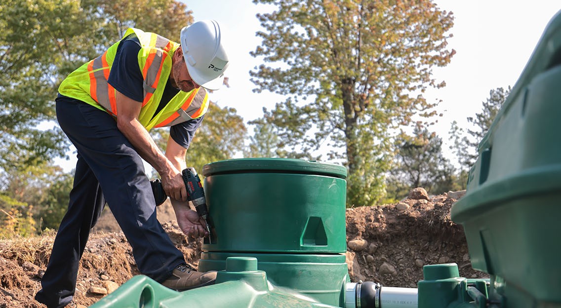 Premier Tech Water and Environment partner installing the Pack model of the Ecoflo biofilter septic system. 