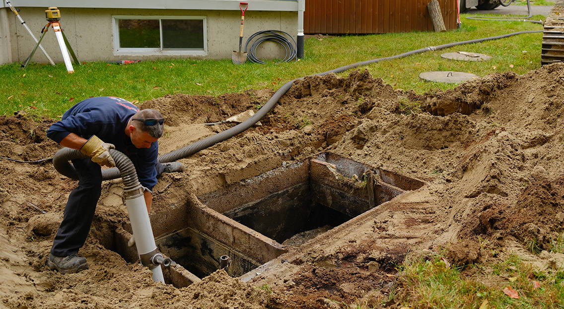Septic contractor replacing a failed Bionest-type septic system with the Ecoflo compact biofilter.