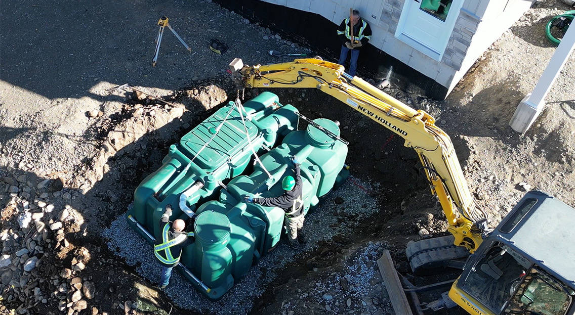 Installation of the Pack model of the polyethylene Ecoflo compact biofilter at a residential site in Ontario.