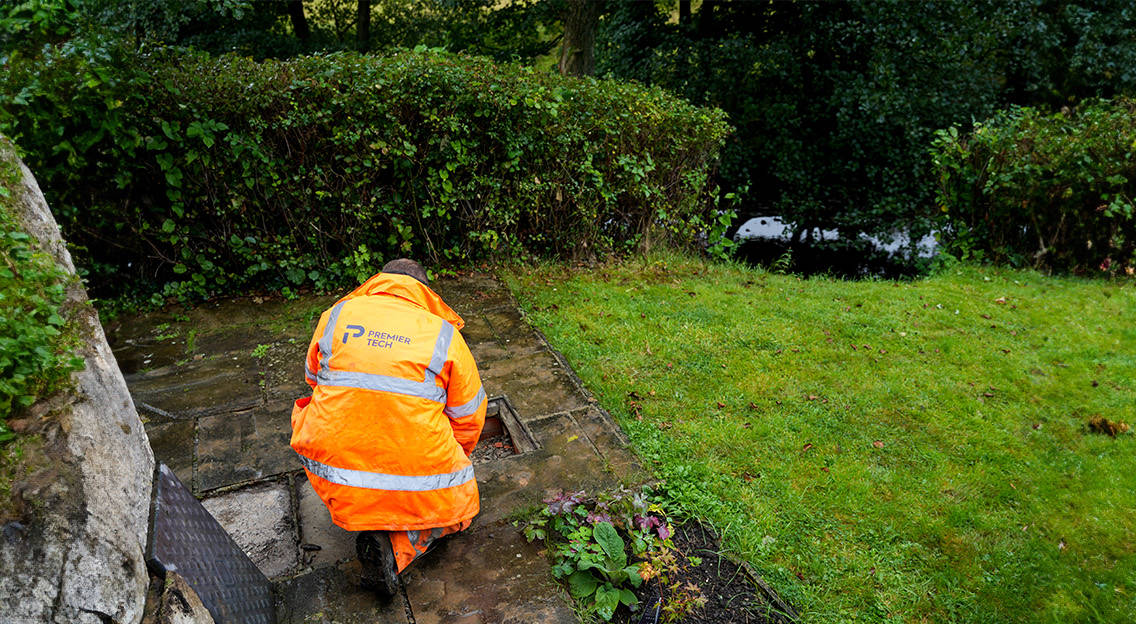 Premier Tech Water and Environment technician inspecting a septic tank in Ireland.