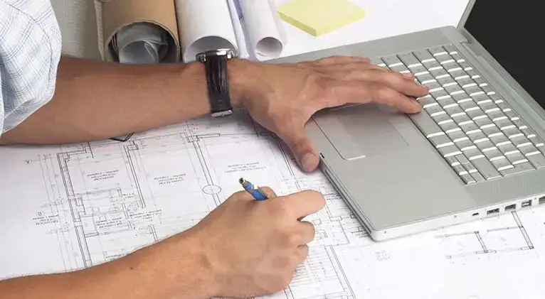 A customer using a laptop in his home to access Premier Tech Water and Environment’s Client Space