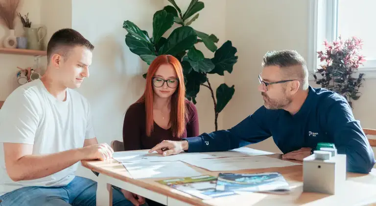 Premier Tech advising young couple about their septic system installation.