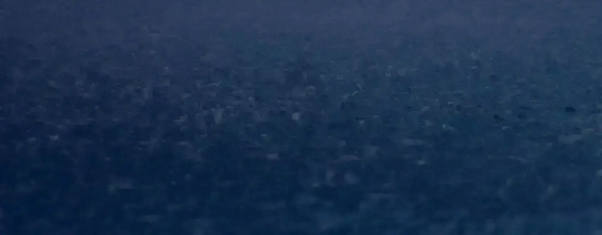 Rainwater falling on a concrete surface.
