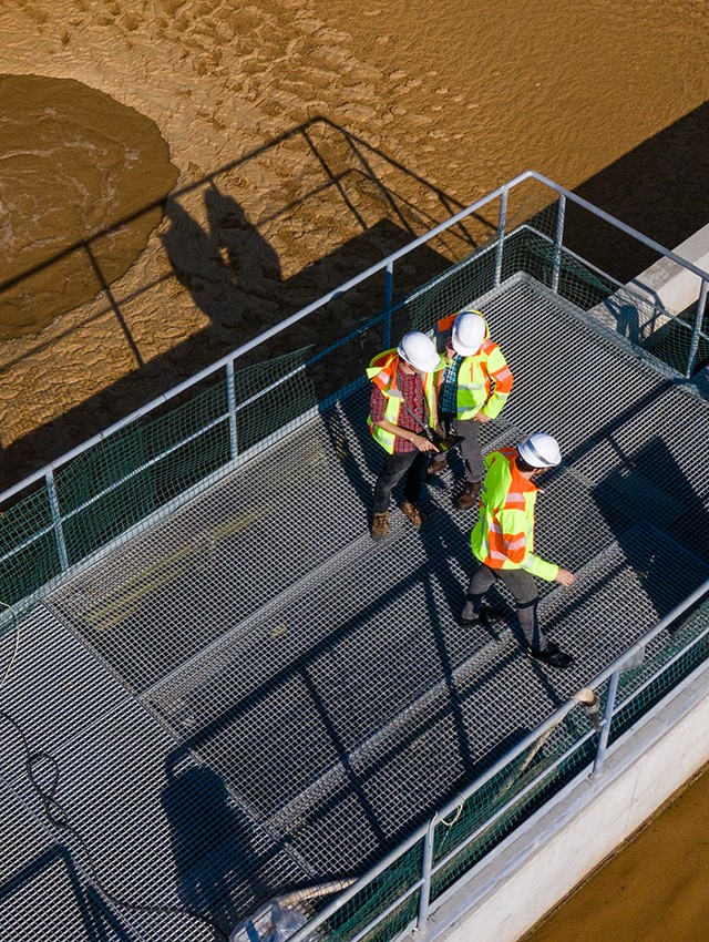 Premier Tech Water and Environment technicians checking the operation of a municipal wastewater treatment plant in India.