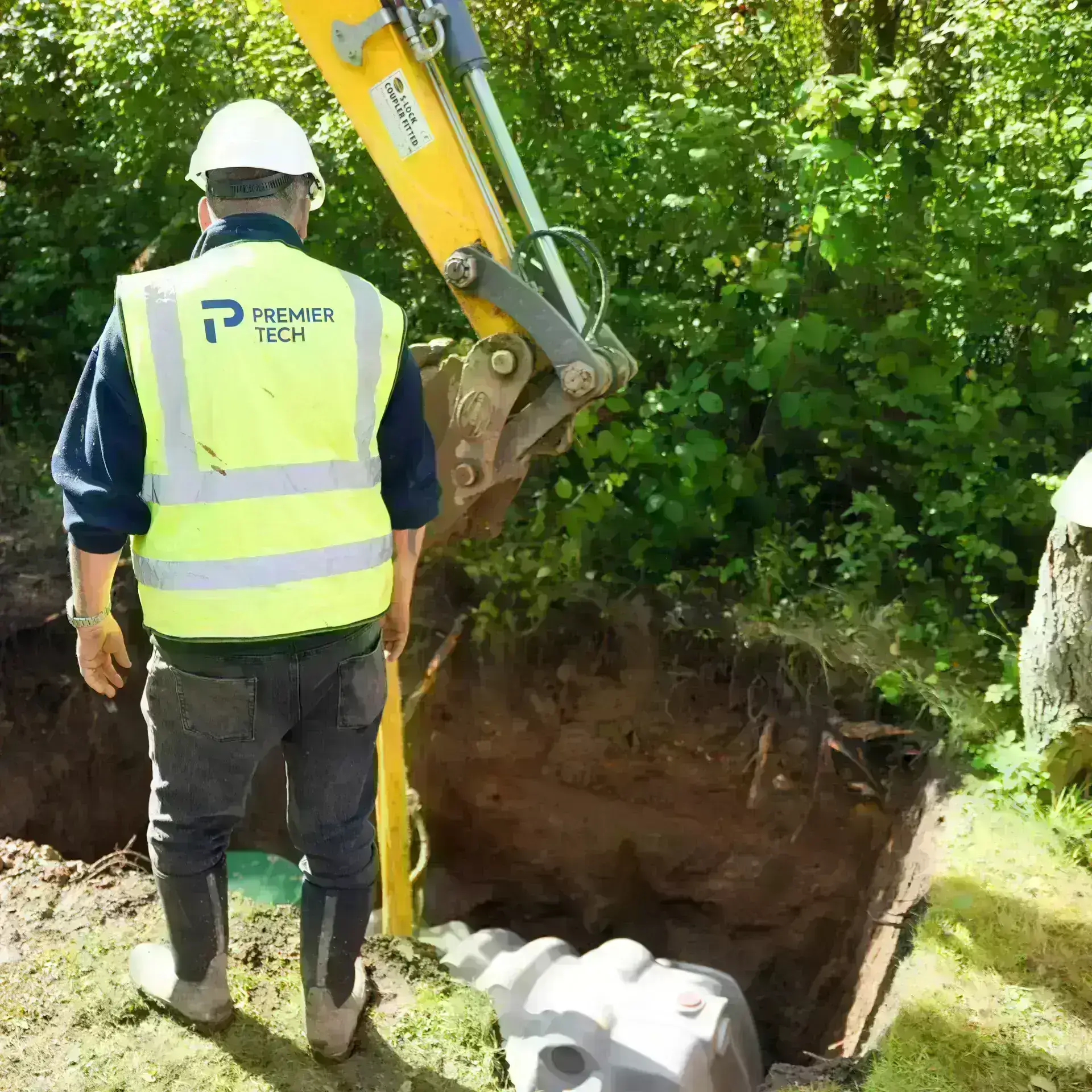 Premier Tech technician installing a septic tank in Ireland.