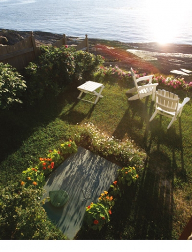 Ecoflo biofilter septic system installed in a yard facing the sunset over the St. Lawrence River in Quebec, Canada.